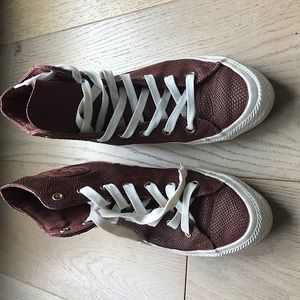 High top leather converse .